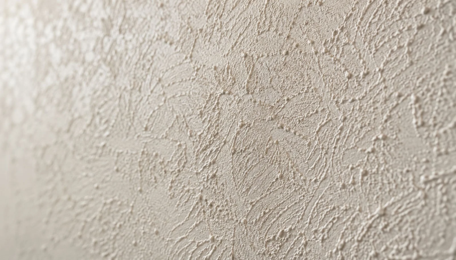 Detail van sierpleister met zichtbare korrelstructuur
