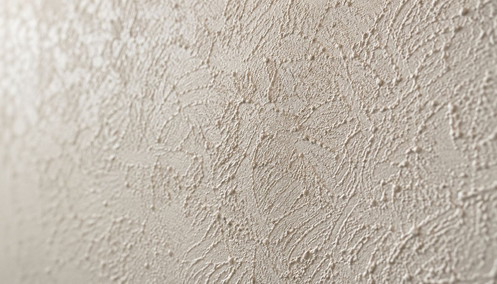 Detail van sierpleister met zichtbare korrelstructuur
